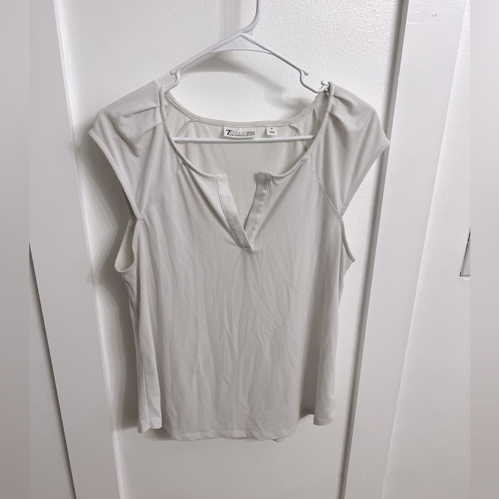 White shirt sleeved top